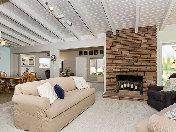 From the front entry hall: Living room, with family room and patio access in the rear, dining and ki