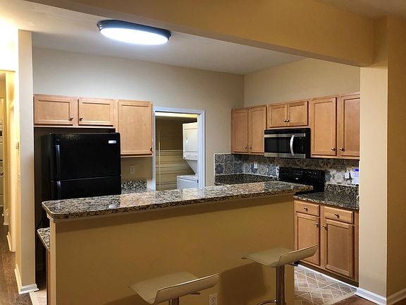 Another View of Kitchen, Spacious Walk-in Pantry and Stackable Laundry Unit