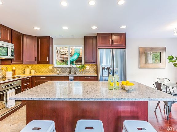The clean and spacious kitchen was fully remodeled for open-concept living.