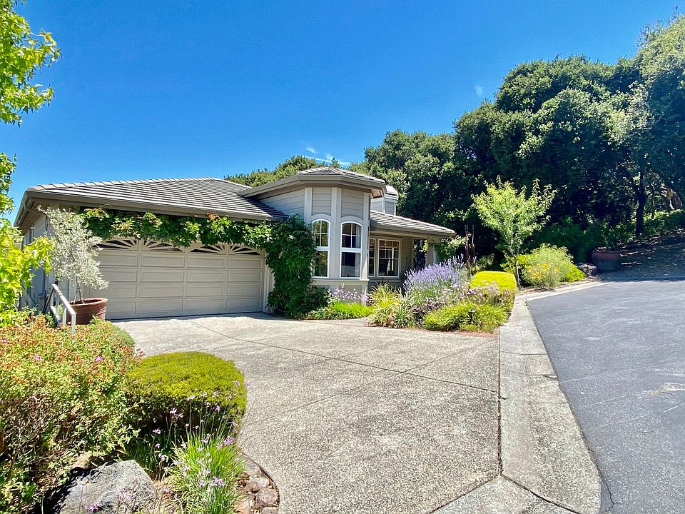 Driveway and front of home at the end of quiet cul-de-sac with adjacent oak tree open space. Only one direct neighbor