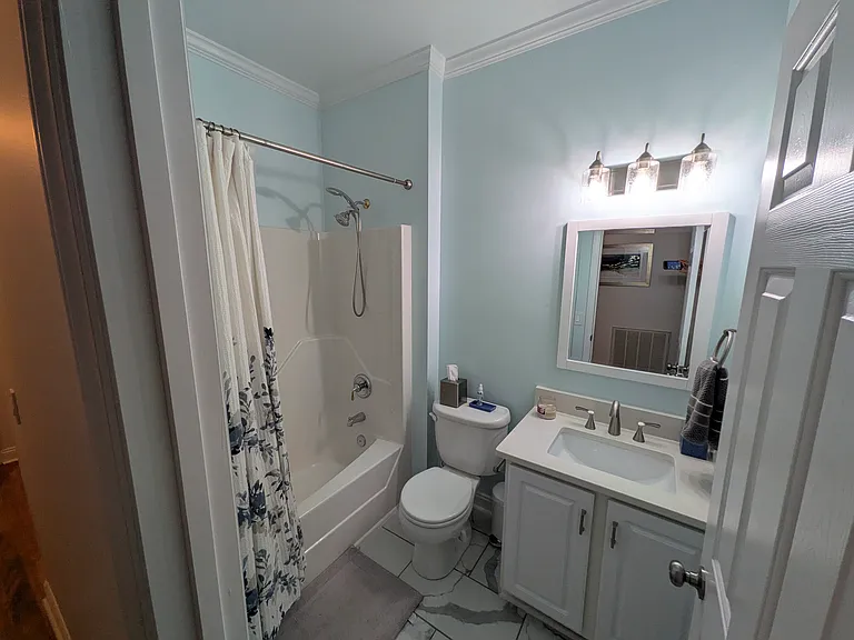 Recently Renovated Guest Bathroom
Recently updated with a new vanity, new tile flooring, and updated lighting, creating a clean and modern space for family and guests.