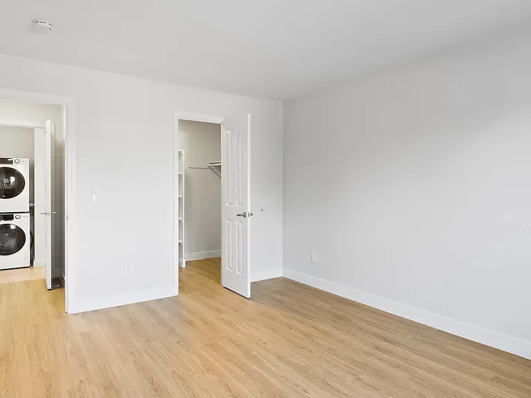 Bedroom with In-home Washer and Dryer
