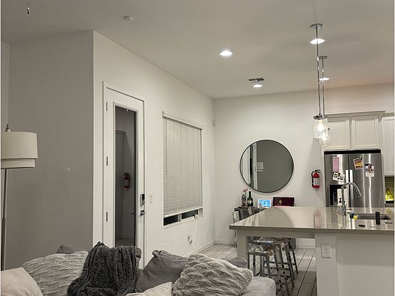 Open concept living room and kitchen (shared space)