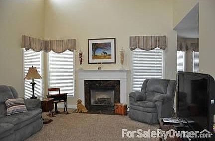 Main Floor Family Room
						:
						13.6x8 two-story family room with gas log fireplace.