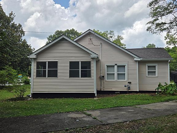 Side of home with Sunroom