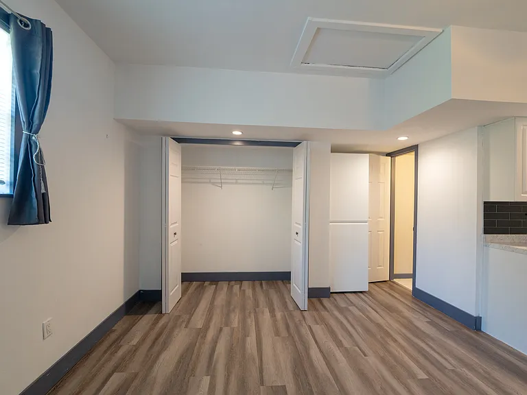 Large closet and additional storage shelf by the bathroom