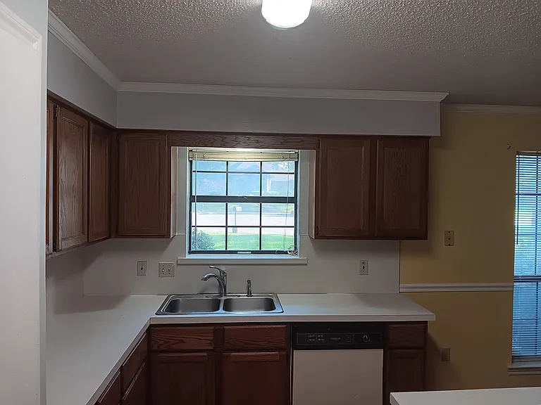 Kitchen with window, natural lighting & LED lighting. Dishwasher, stove and range included. Plenty of cabinet space, even above designated refrigerator space. Bring own frig.