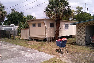 Lot #37 with covered carport and storage