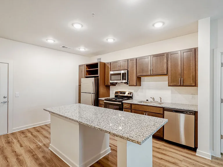 Unit Kitchen with Front Door in the Background