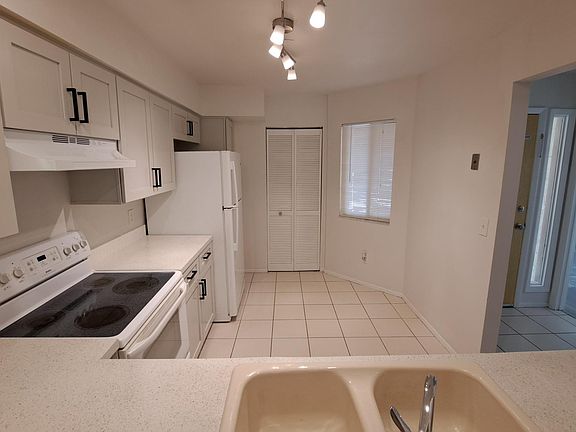 View of kitchen from pass-thru to dining area.