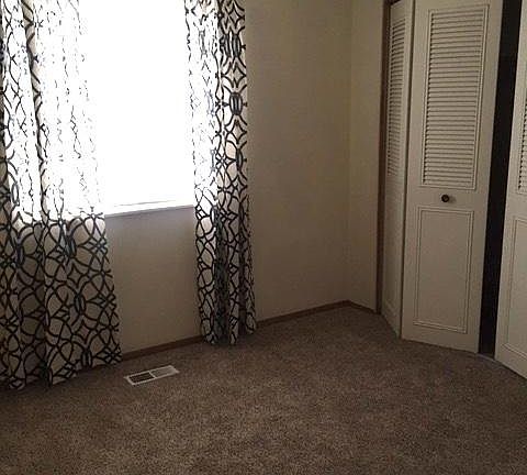 Bedroom number two with new blinds and curtains