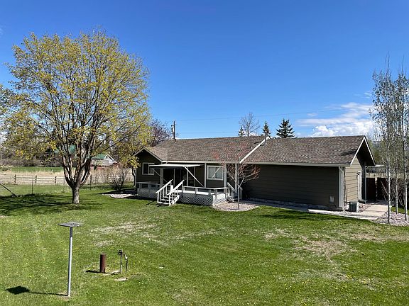 Fenced backyard, deck, awning, underground sprinklers. Backyard faces the Stillwater river.