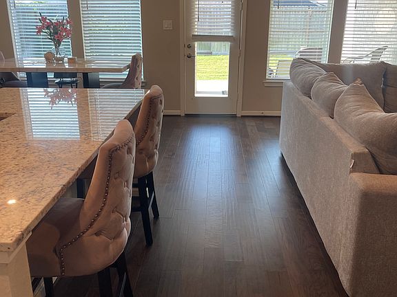 Open kitchen & living space with lots of windows overlooking backyard. Abundance of natural light.