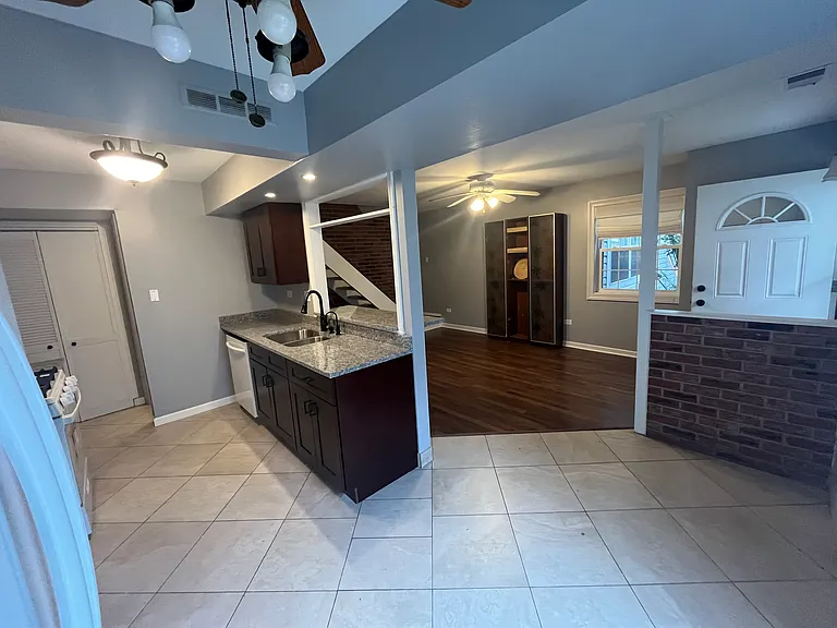Granite, tile kitchen, new cabinets. New flooring in living room. ceiling fans in most rooms