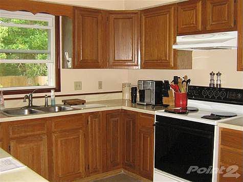 Lots of cabinets with a lazy susan in the corner