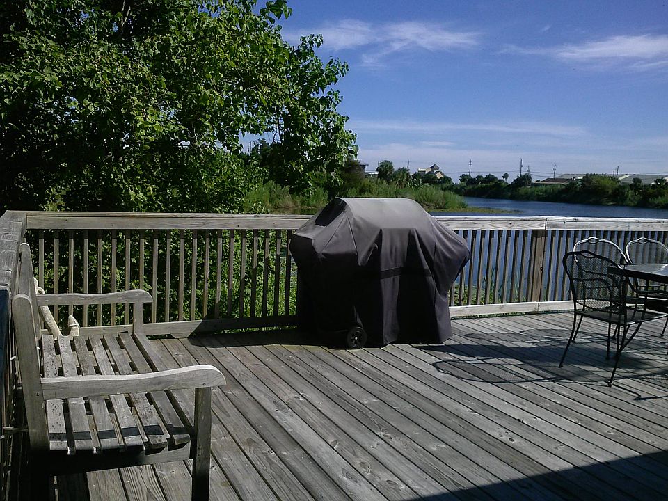 Large lake front deck with view of the Gulf of Mexico