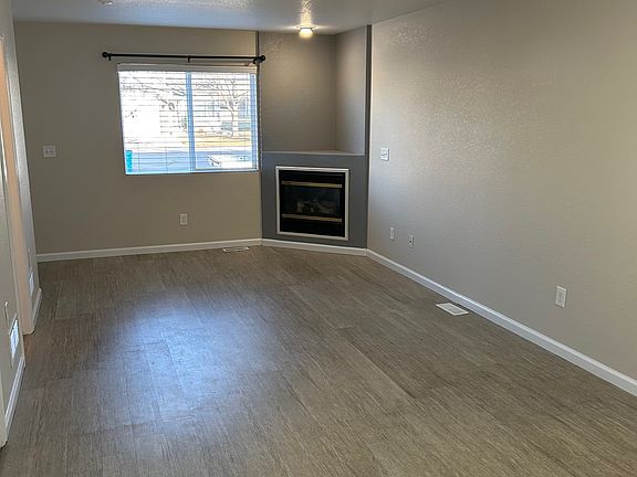 Main level living room with gas fireplace.