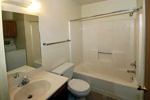 Bathroom w/ washer and dryer.