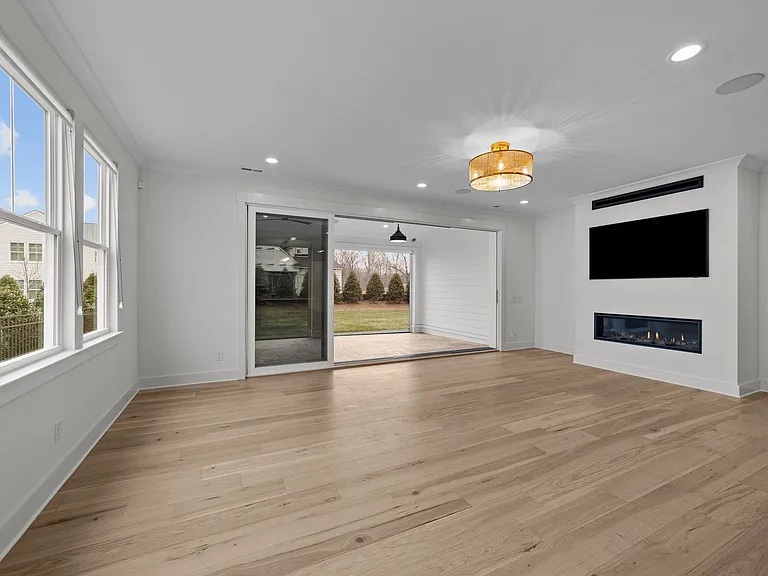 Spacious living room with accordian doors leading out to the outdoor living
