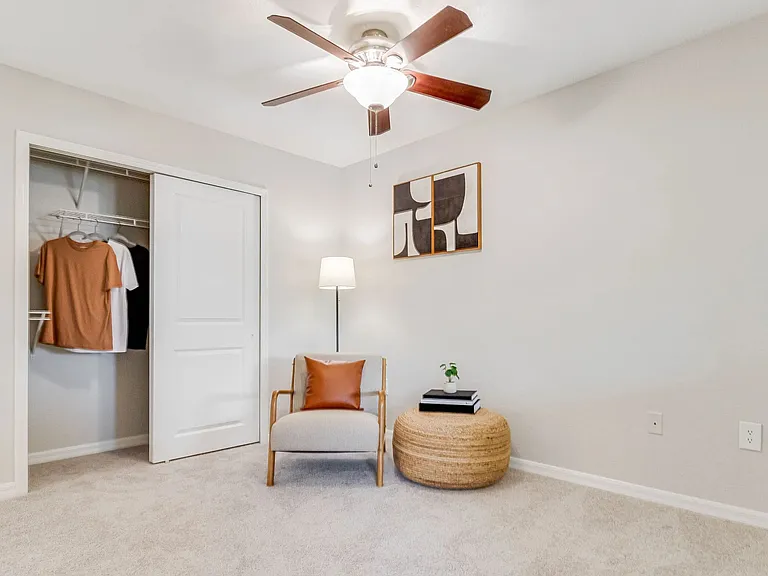 Experience the joy of spacious bedrooms featuring built-in shelving and refreshing ceiling fans, creating an oasis of luxury and comfort.