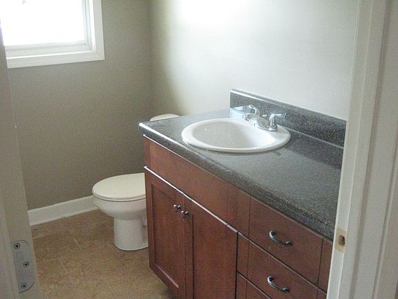new bath with tile shower and floor