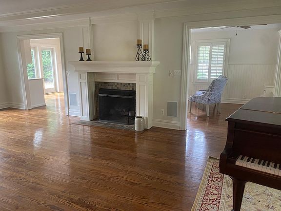 living room with piano