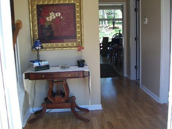 Hardwood entry foyer that greets family and guest with warmth.