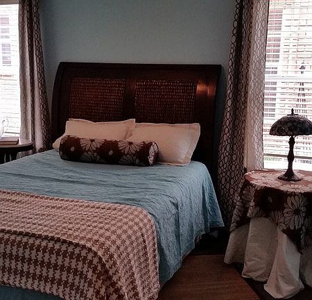 Master bedroom. King size bed fits between windows.