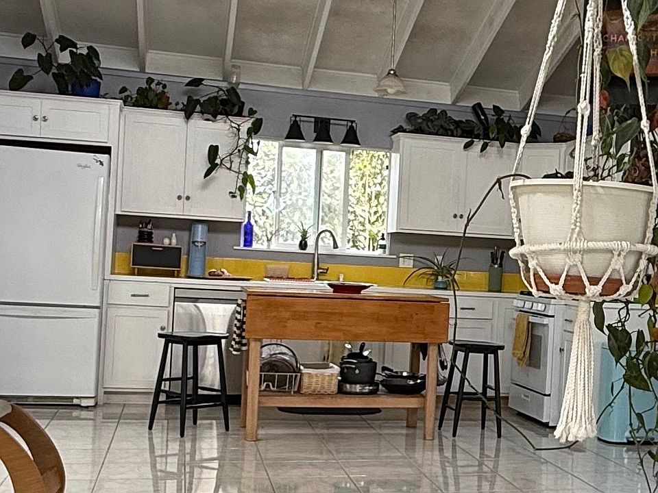 bright kitchen with dishwasher and gas stove.