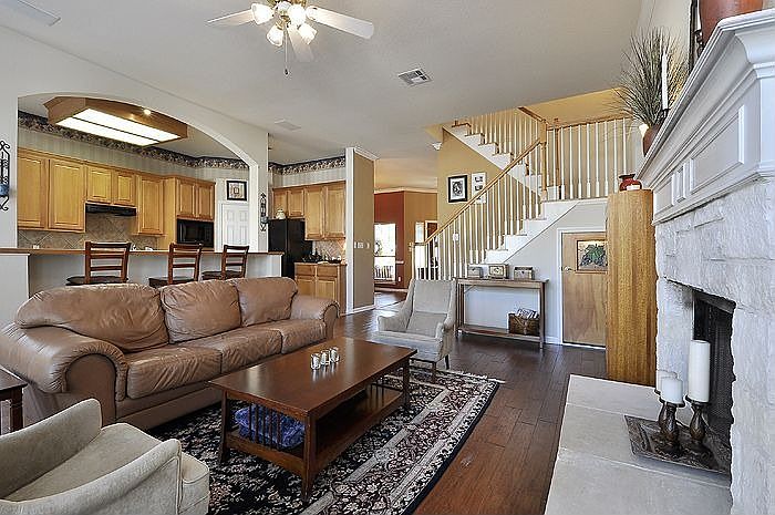 Family room with limestone fireplace and wine closet