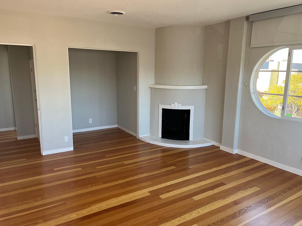 Living room with fireplace and office nook.