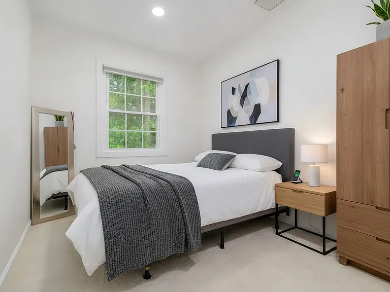 Au-pair or guest bedroom on first floor. Virtually staged