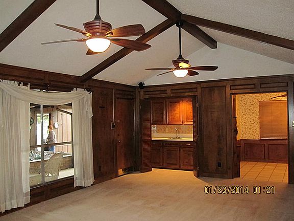 Beautiful Custom Block Paneling and wood beams in living area