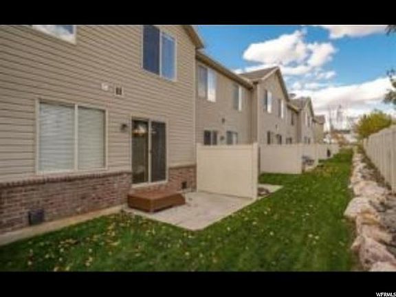 Back (fence has been installed around the patio)