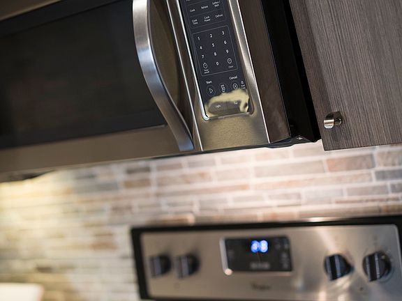 Kitchen stainless steel stove and microwave