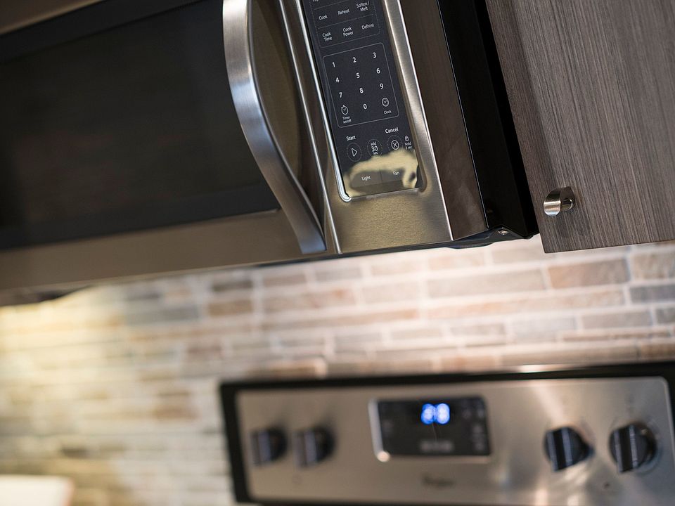 Kitchen stainless steel stove and microwave