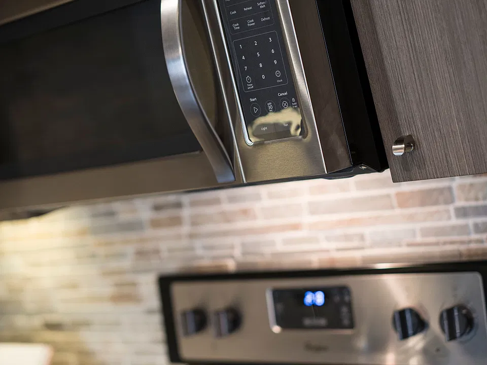 Kitchen stainless steel stove and microwave