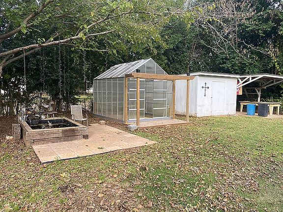 Greenhouse.Small pond & shed