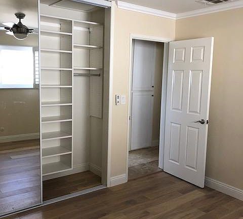 Two bedrooms with custom closet organizers, ceiling fans, ha