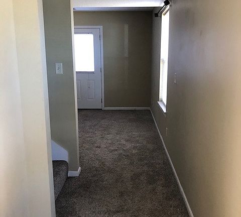 Looking from front door to back door in living room