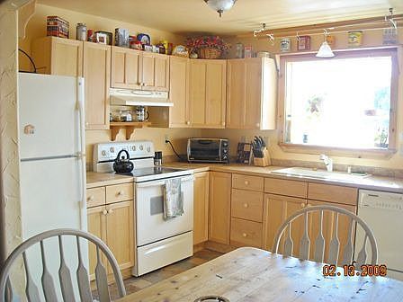 Open & Well Lit Kitchen w/ plenty of counter space for food prep