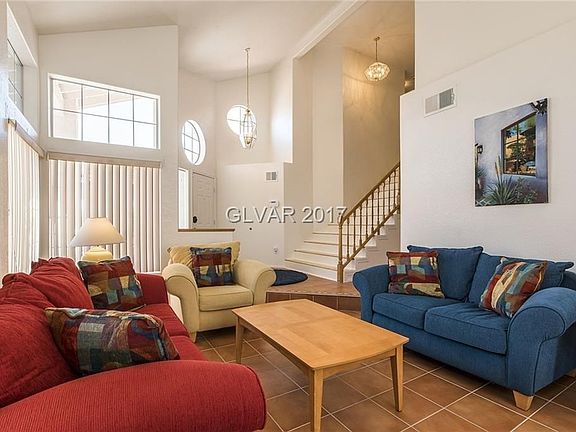 Living room with its entry foyer.