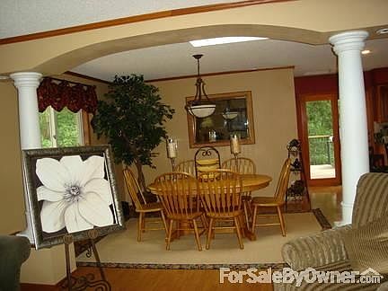Dining Room
						:
						Open to kitchen and livingroom. Archway with columns.