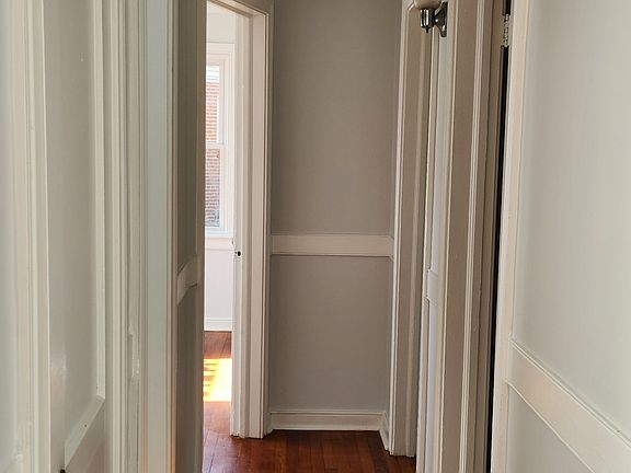 Hallway to bathroom and 3 bedrooms.