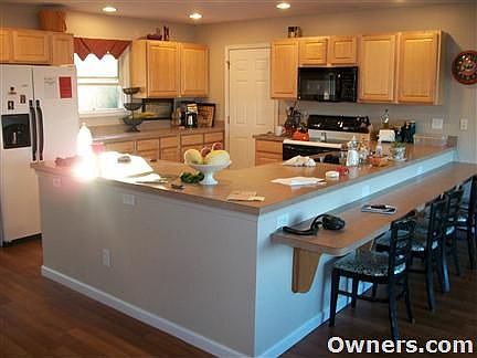 Open-concept kitchen with recessed lighting