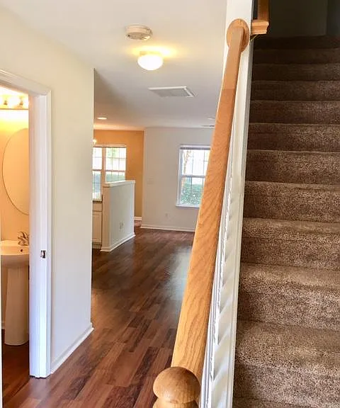 Front door perspective, guest bathroom and closet on the left