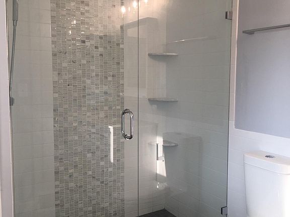 Custom glass shower off front bedroom. 
