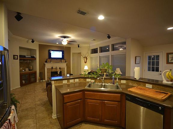 Large entertaining area with great flow. Built-ins and fresh paint. Ceramic flooring throughout.