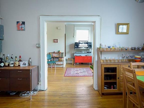 View of dining area facing west into west bedroom.