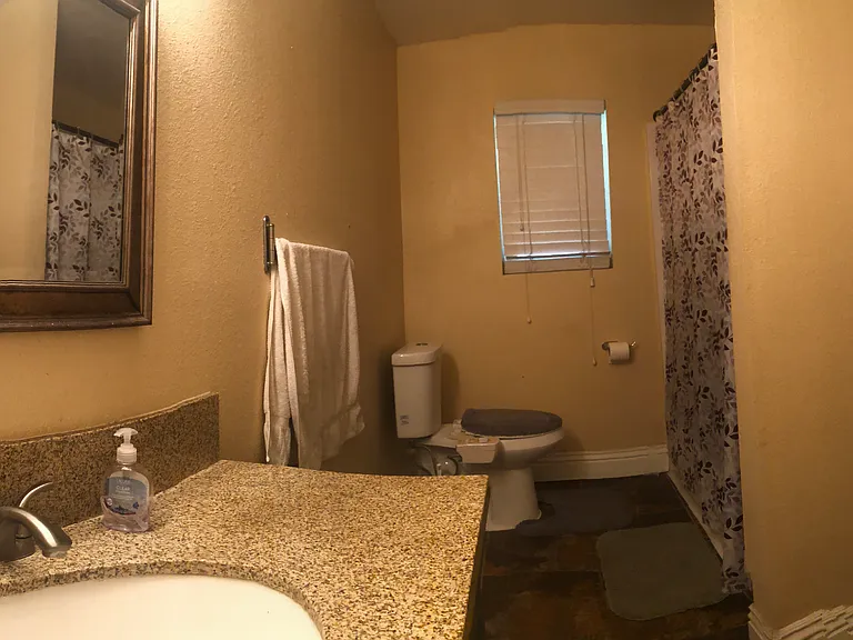 Full shared Bathroom with storage space